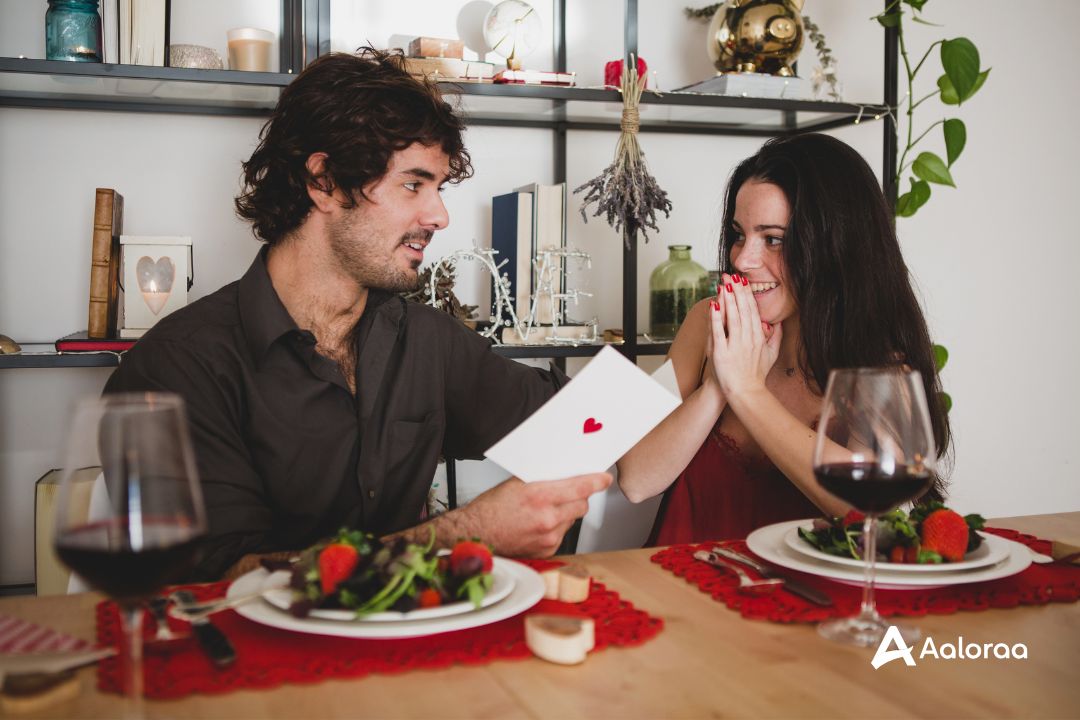 Cute Couple at Dinner Cute couple sharing a moment of what the card says while they are having dinner with a nice glass of wine.